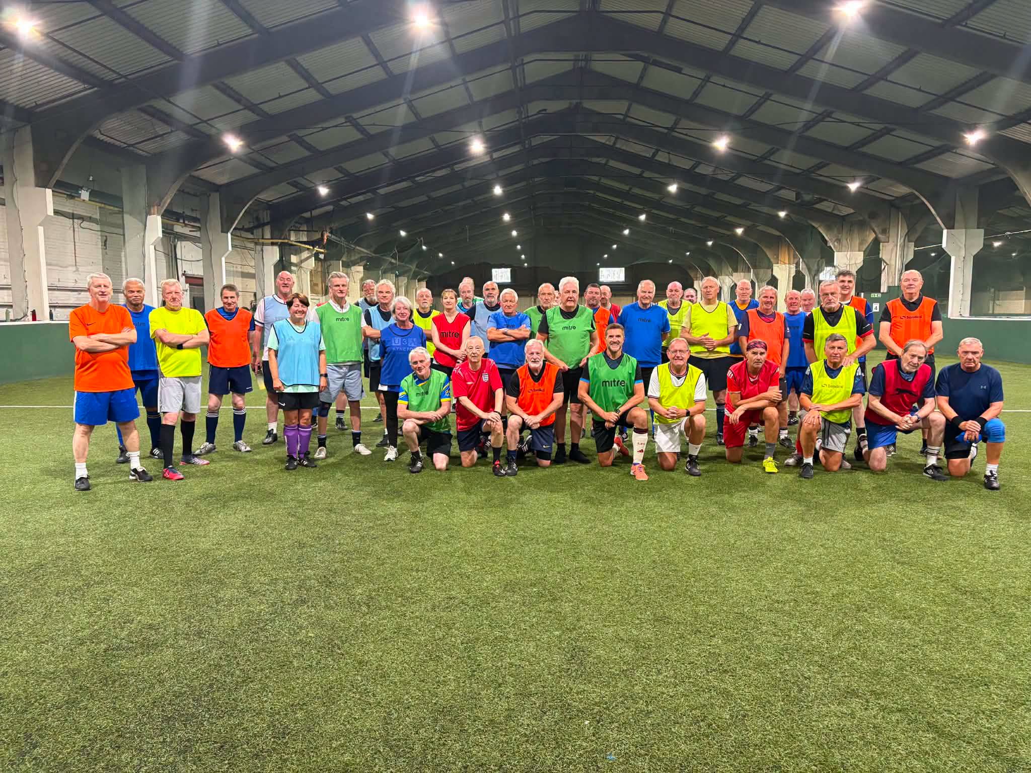 The Wakefield Football Centre walking football group gathered together on the indoor pitch